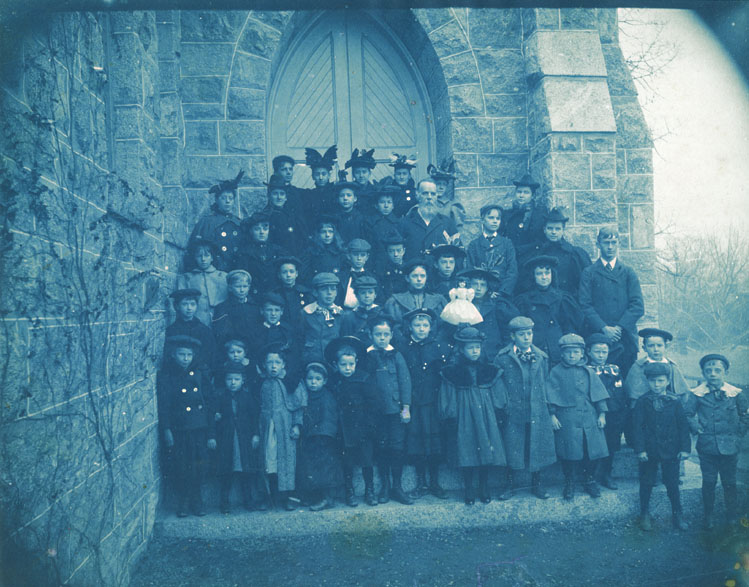 Group of Children with Adult Supervision and One Doll