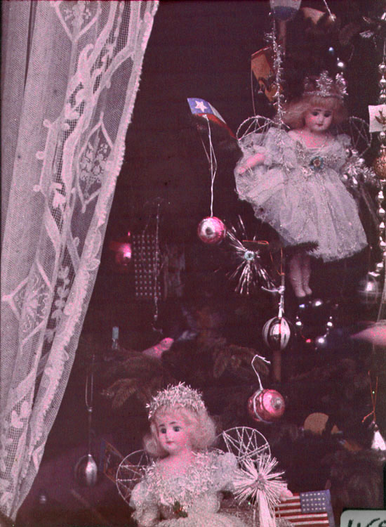 Anonymous - Display of Dolls, Christmas Ornaments and American and Chile Flags