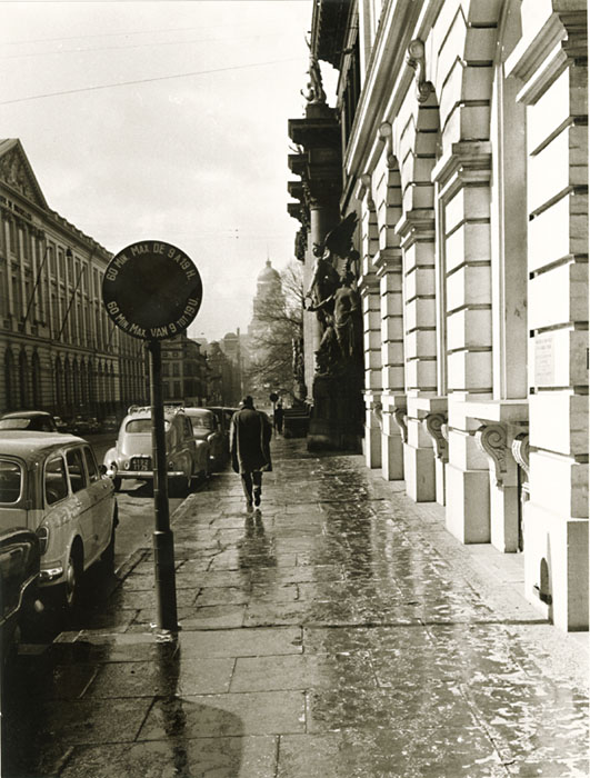Robert Kayaert - Man Walking on Rainy Street in Brussels, Belgium