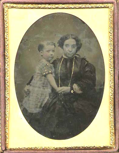 Anonymous - Woman with Long Necklace Holding Her Child