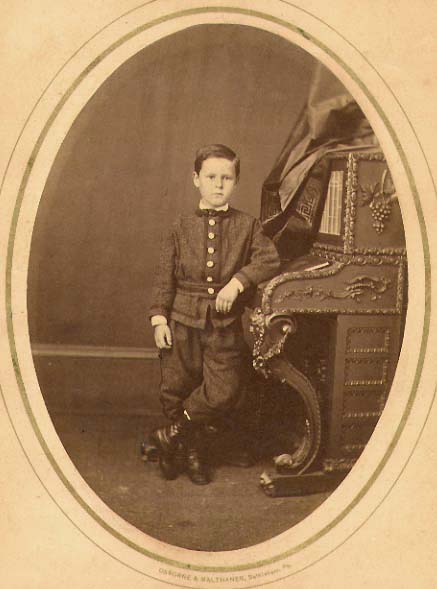 Portrait of a Boy at His Piano-like Desk