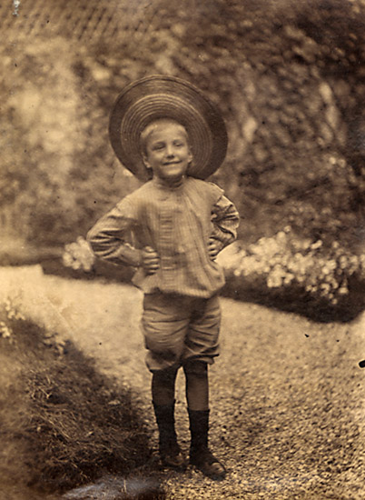 Boy in Staw Hat in Garden