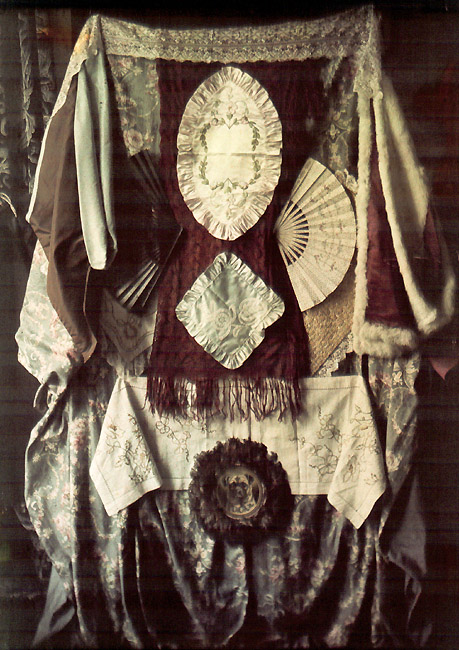 Still Life of Textiles, Fans and Wood Carved Frame