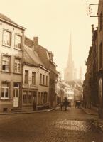 Leonard Misonne - A Cobblestone Brussels Street with Horse Carriages