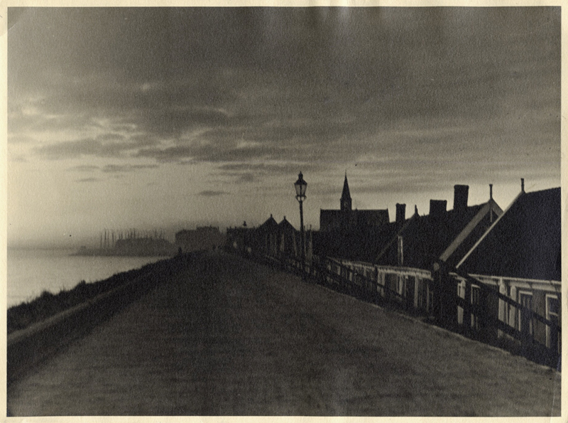 Anonymous (Tokyo Archive) - Road along river with church spire and houses.