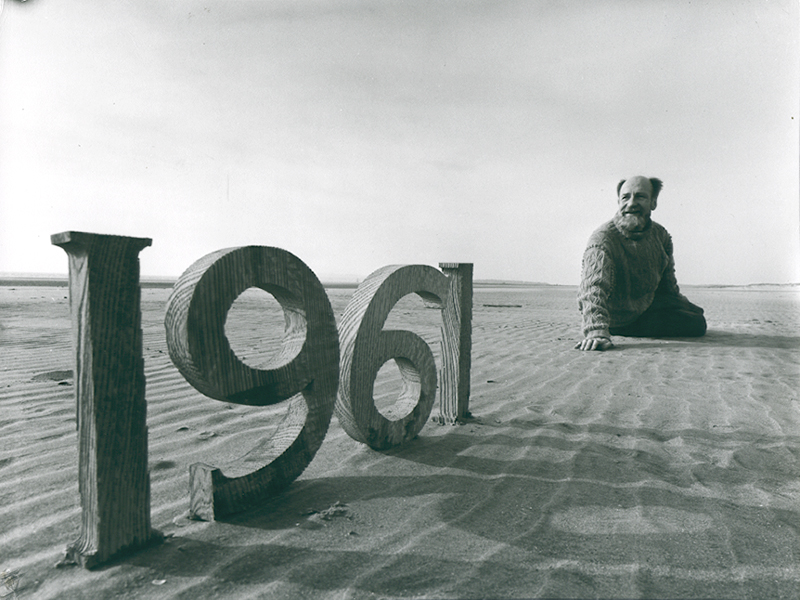 Christmas Card 1961 - Self Portrait on Beach with Wooden Numbers