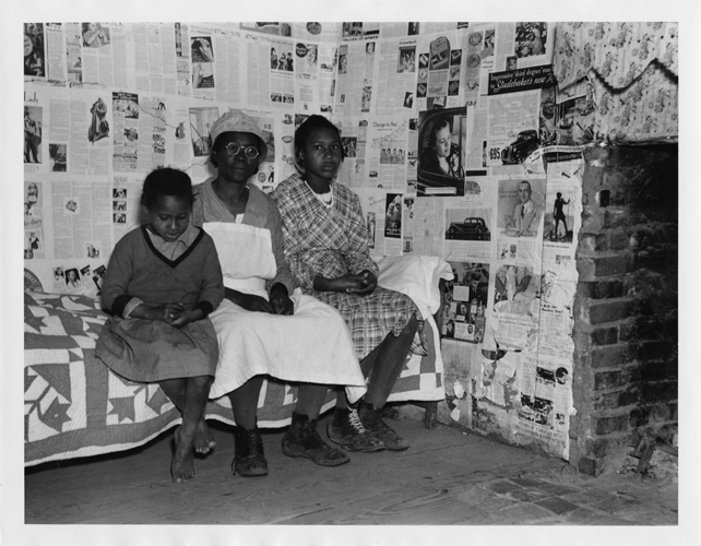 Arthur Rothstein - African American Woman and Two Children Sitting on Bed