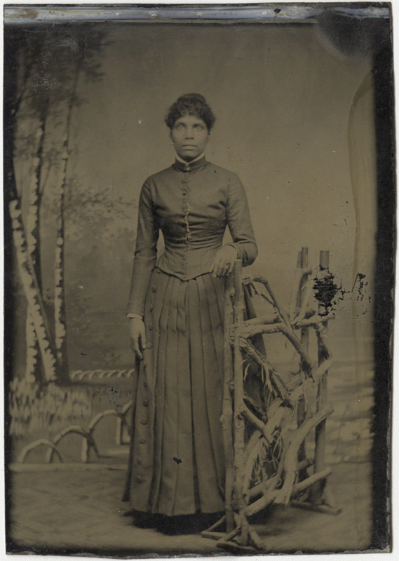 Portrait of an African American Woman in Long Pleated Skirt