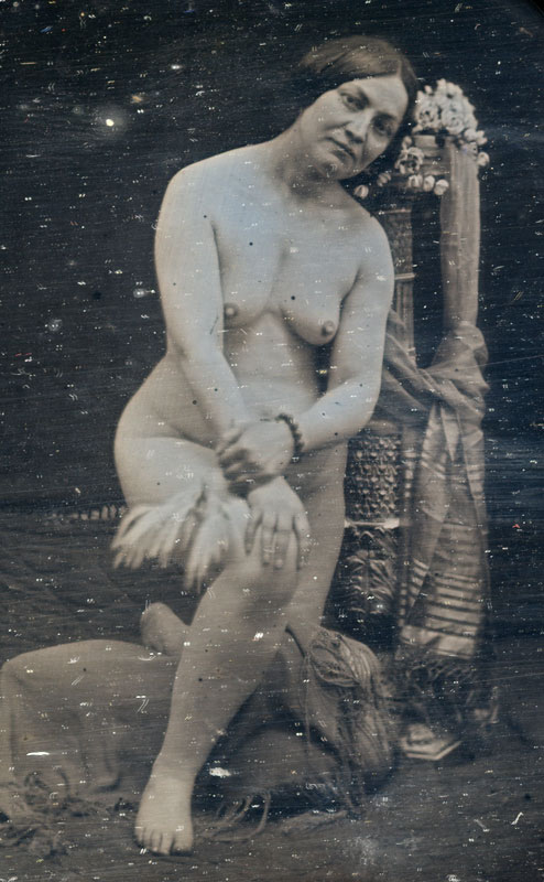 Anonymous - Female Nude Kneeling Amongst Artifacts and Textiles