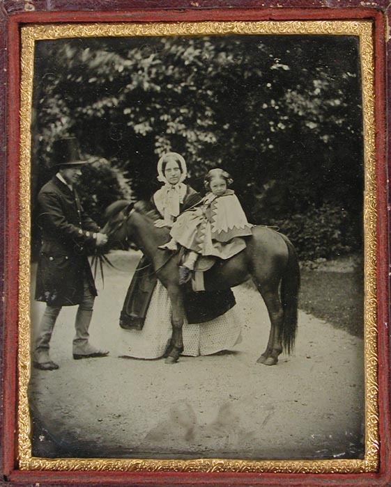 Anonymous - Little Girl on Pony with Man and Woman Standing Alongside