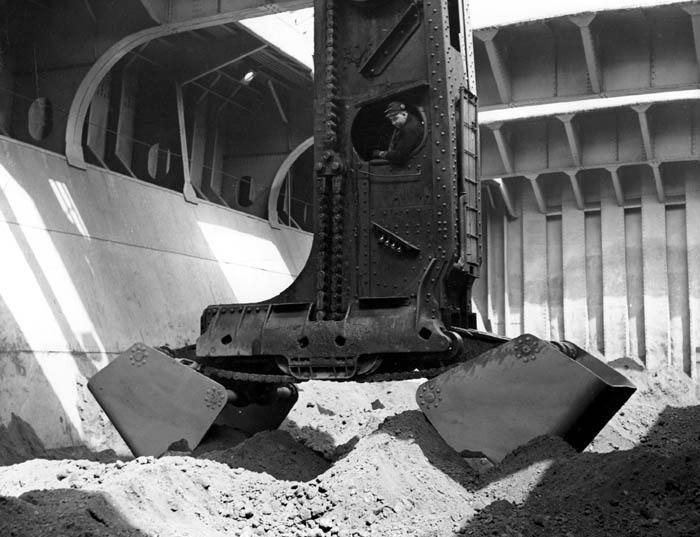 Anonymous - A Hulett Unloader Shown Removing Iron Ore From the Hold of A Steamer at U.S. Steel