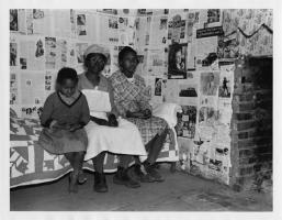Arthur Rothstein - African American Woman and Two Children Sitting on Bed