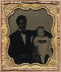 Anonymous - A powerful and unusual image of a young black man, with a white child.