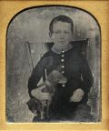 Anonymous American - "Portrait of a Young Boy Seated in a Straight Backed Chair and Holding His Dog"