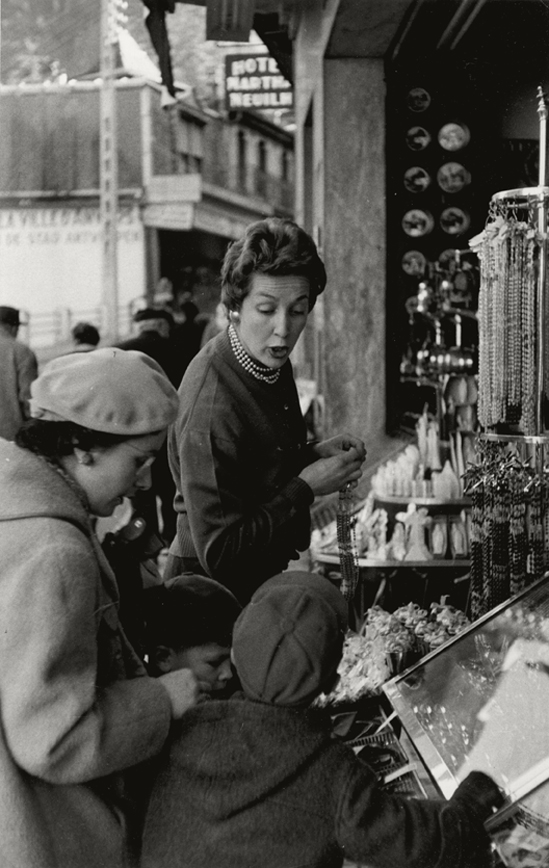 Henri Cartier-Bresson - Woman Shopping with Children, Lourdes