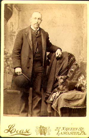 Lease - Man with a Bowler Hat and Dog