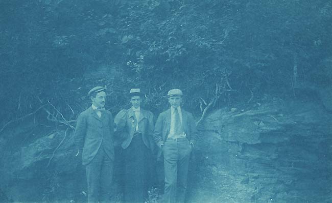 Anonymous - Two Men and a Woman Standing in Front of a Rock Wall Anonymous - Two Men and a Woman Standing in Front of a Rock Wall