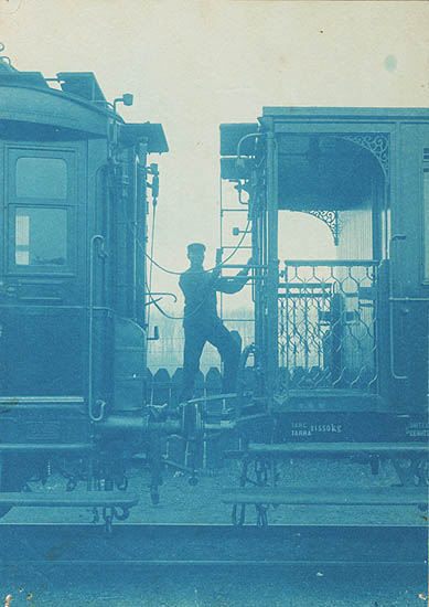 Anonymous - Train Worker between Cars Anonymous - Train Worker between Cars