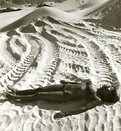 Japanese Woman in Bikini Lying in Tire Tracks in Sand