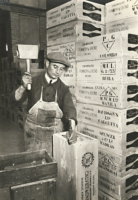 Ilse Bing - Man Hammering and Constructing Wooden Crates for Champagne