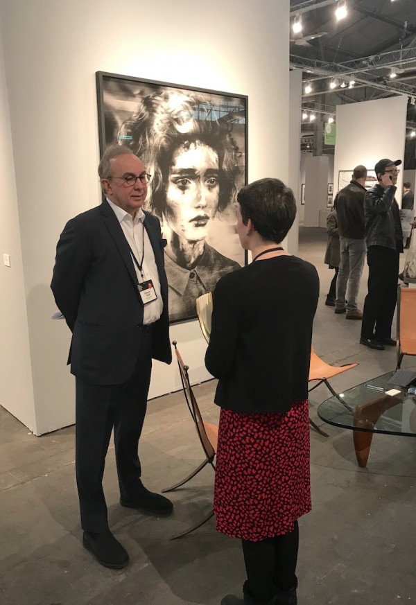 Edwynn Houk in his booth chatting with his associate Julie Castellano.  (Photo by Matt Damsker © I Photo Central, LLC)