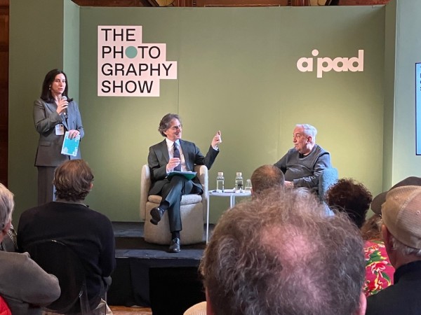 AIPAD Talks. Lydia Melamed Johnson, Executive Director of AIPAD, introducing Jeff Rosenheim, Joyce Frank Menschel Curator in Charge of the Department of Photographs, The Metropolitan Museum of Art, and Vince Aletti, winner of the 2024 AIPAD Award.  (Photo by Michael Diemar)