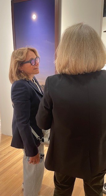 Newscaster Katie Couric discussing Jerry Spagnoli's "Eclipse" with Marthe Smith.