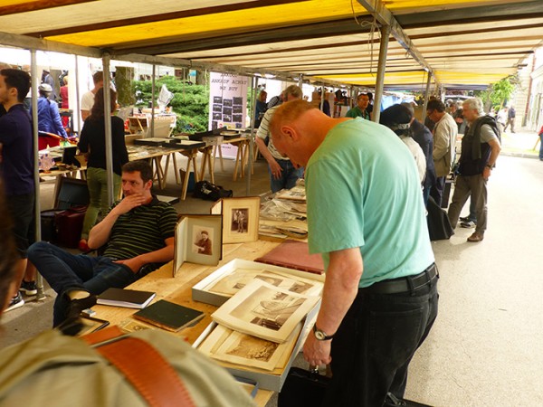 Author checking out images in Bievres. (Photo Courtesy of Hans Gummersbach)