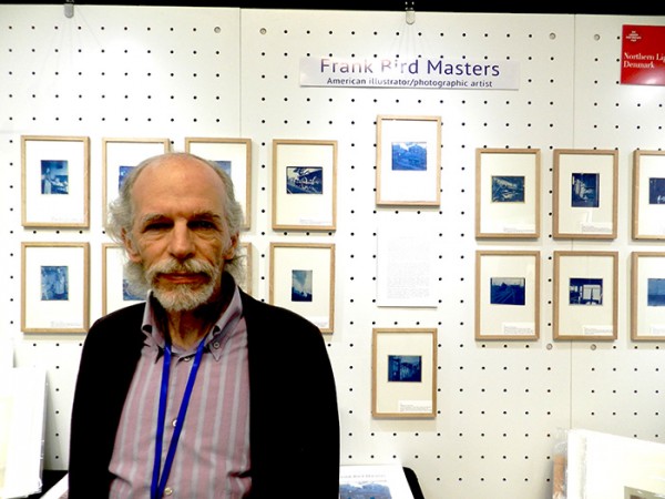 Andrew Daneman of Northern Light with Frank Bird Masters' cyanotypes. (Photo by Michael Diemar)